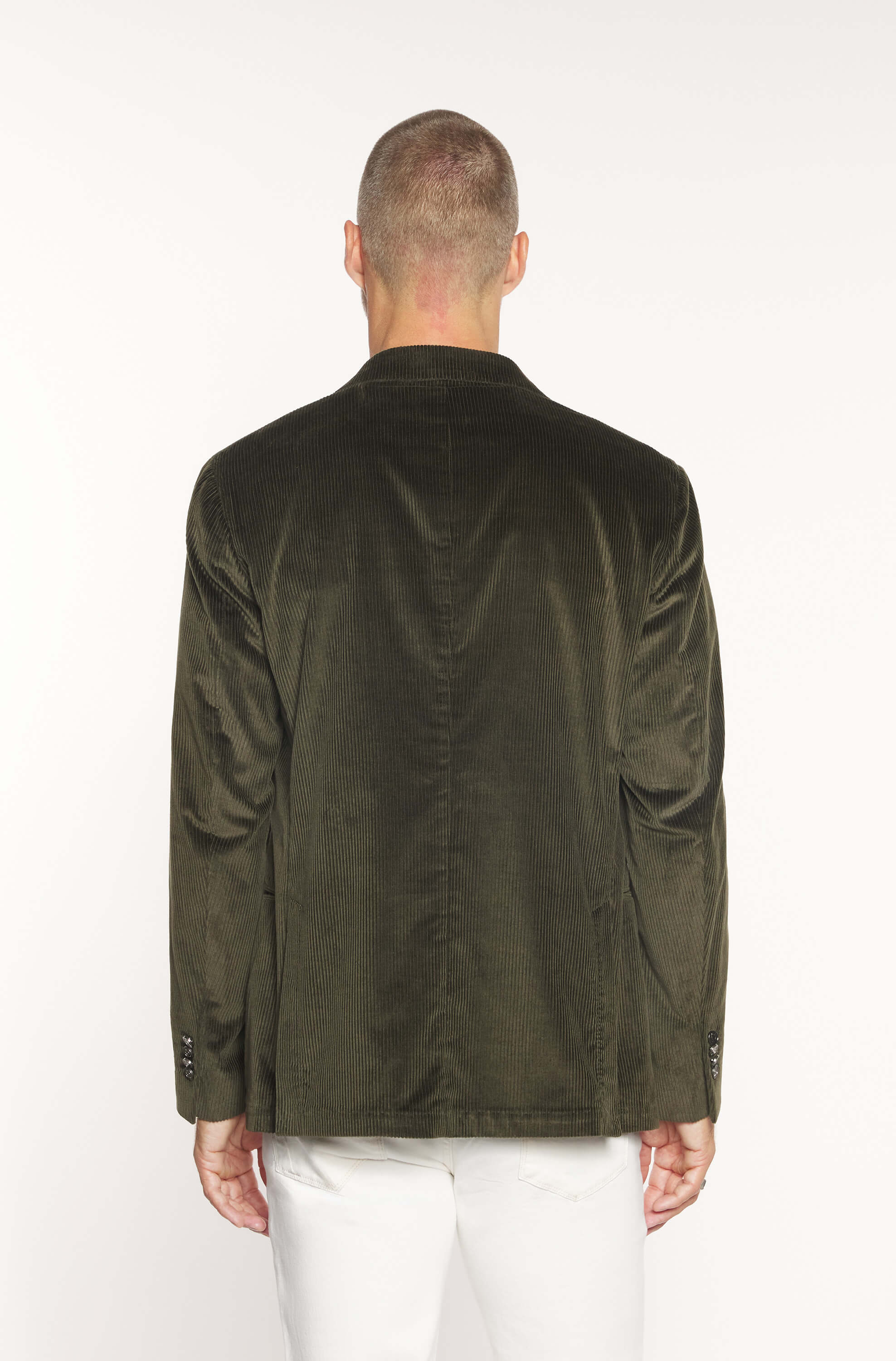 Rear view of the model wearing the crossed jacket in khaki velvet