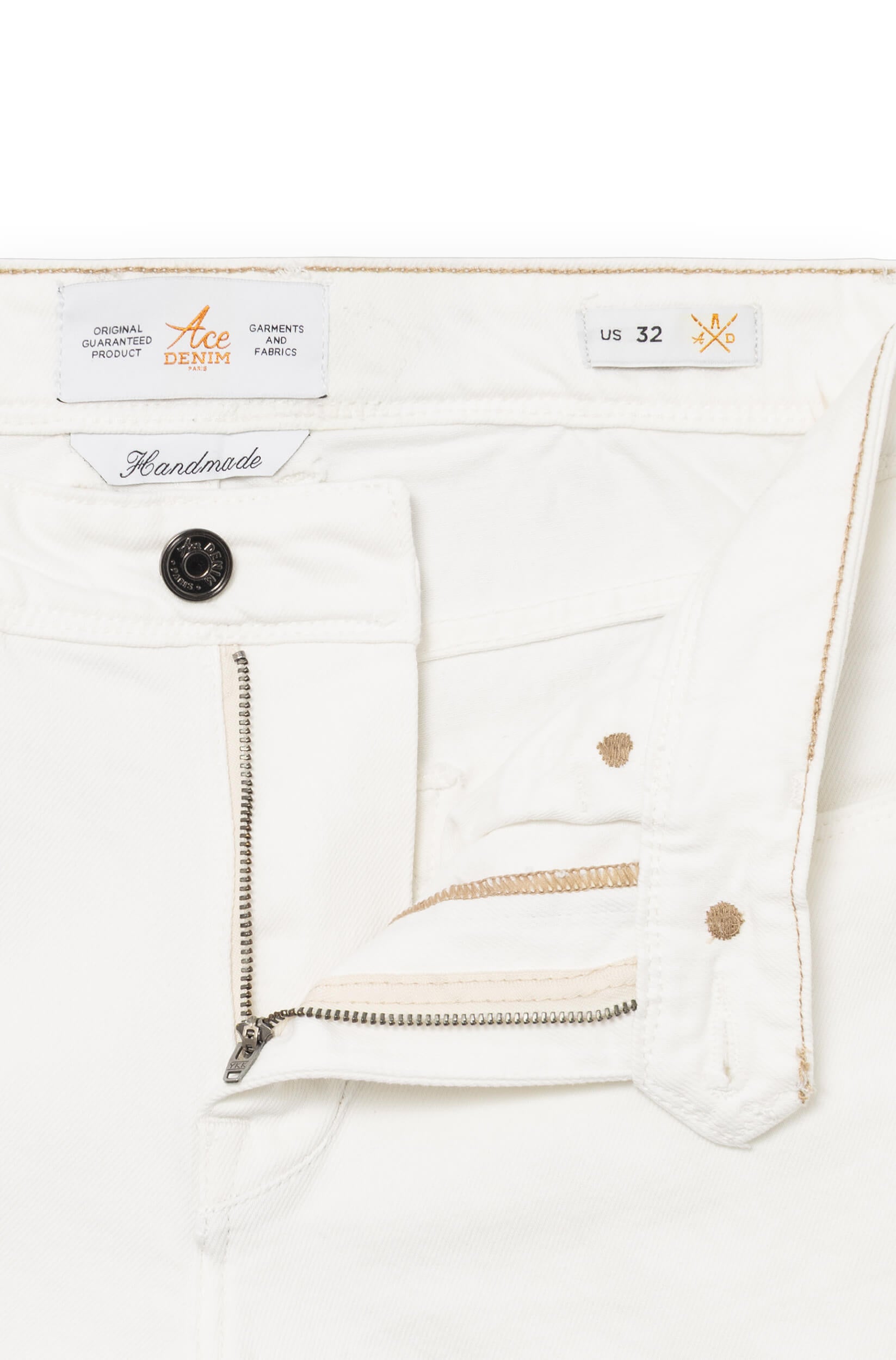 Detail of the front of the jeans with metal button and fly