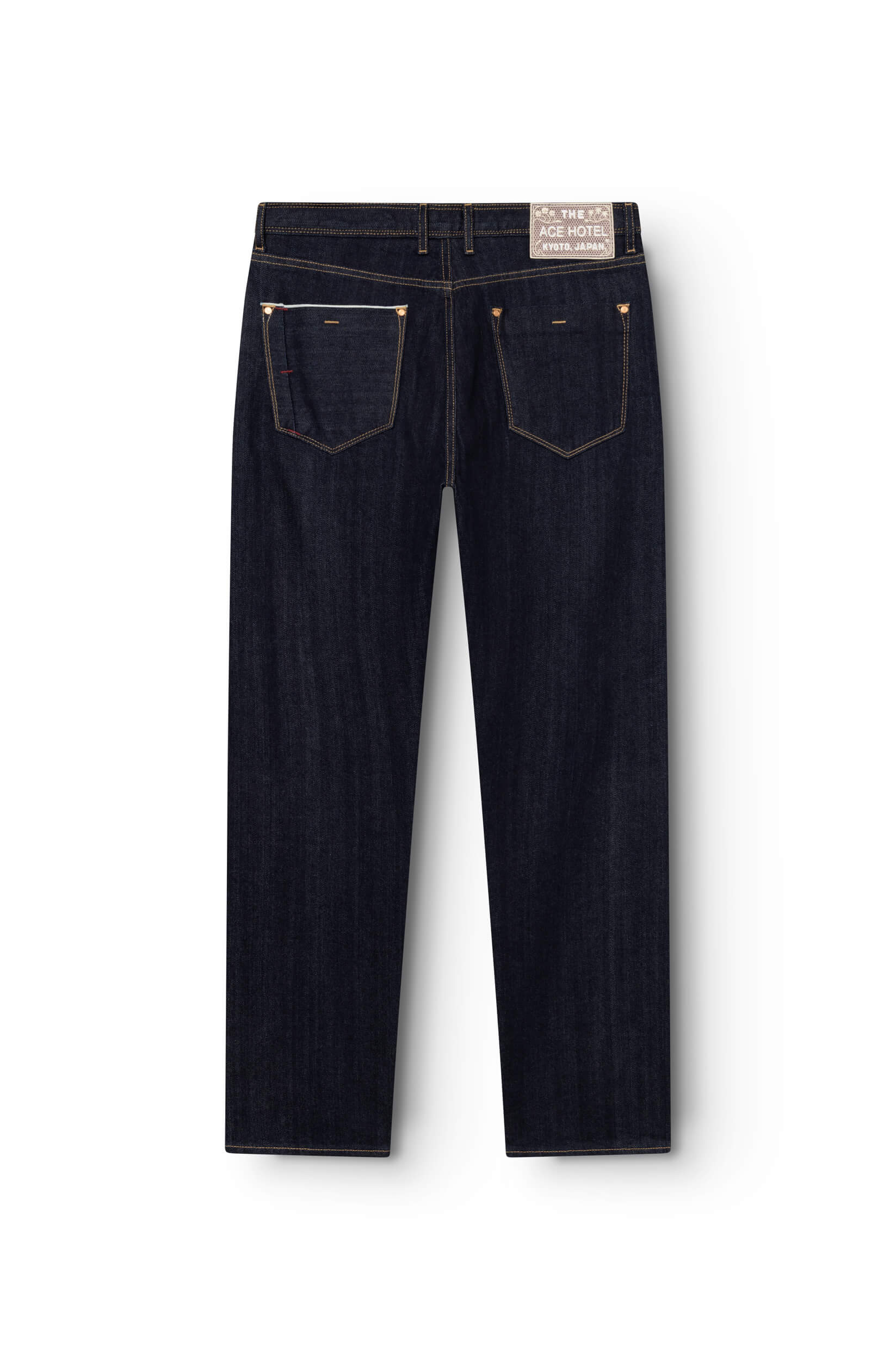 Back view of raw selvedge straight jeans with embroidered signature patch on waistband — AD 53 Selvedge Ace Denim Paris