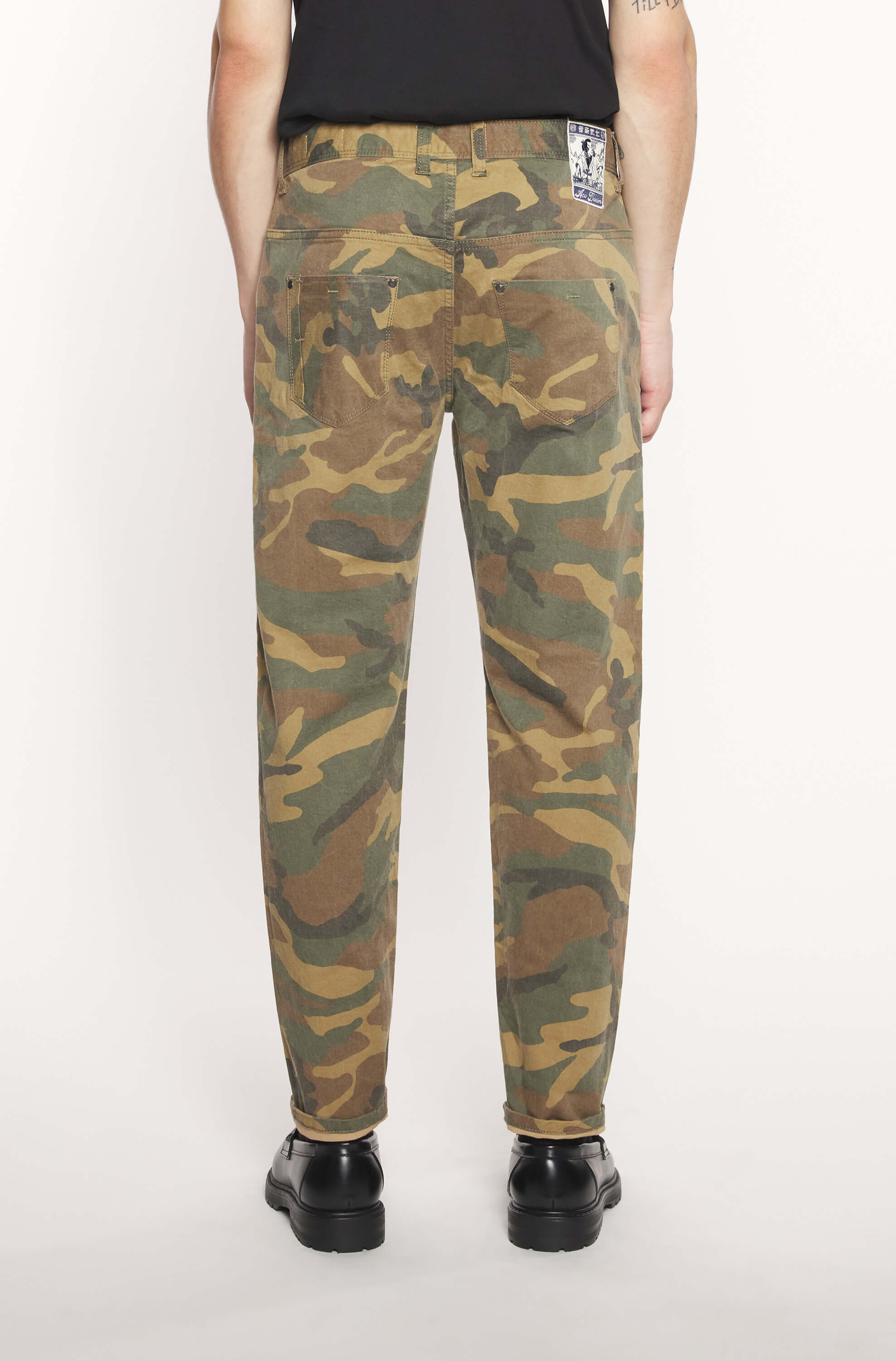 Back of the model wearing the selvedge jeans with camouflage pattern