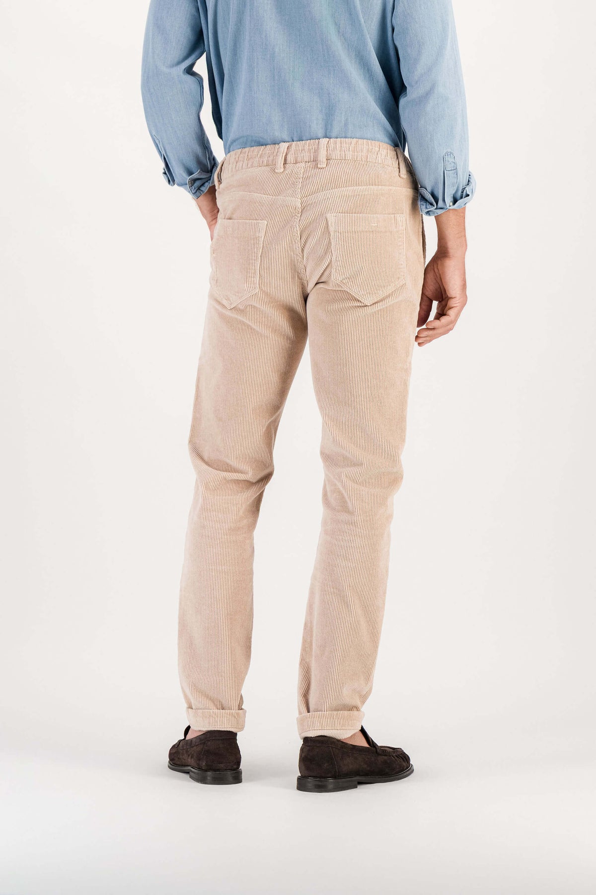 Full-length back view, beige corduroy trousers, blue denim shirt, brown loafers, model 186 cm size 32 — Ace Denim Paris