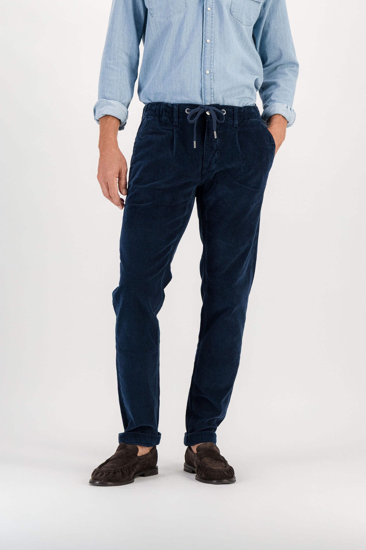 Full-length front view, navy corduroy trousers, blue denim shirt, brown loafers, model 186 cm size 32 — Ace Denim Paris