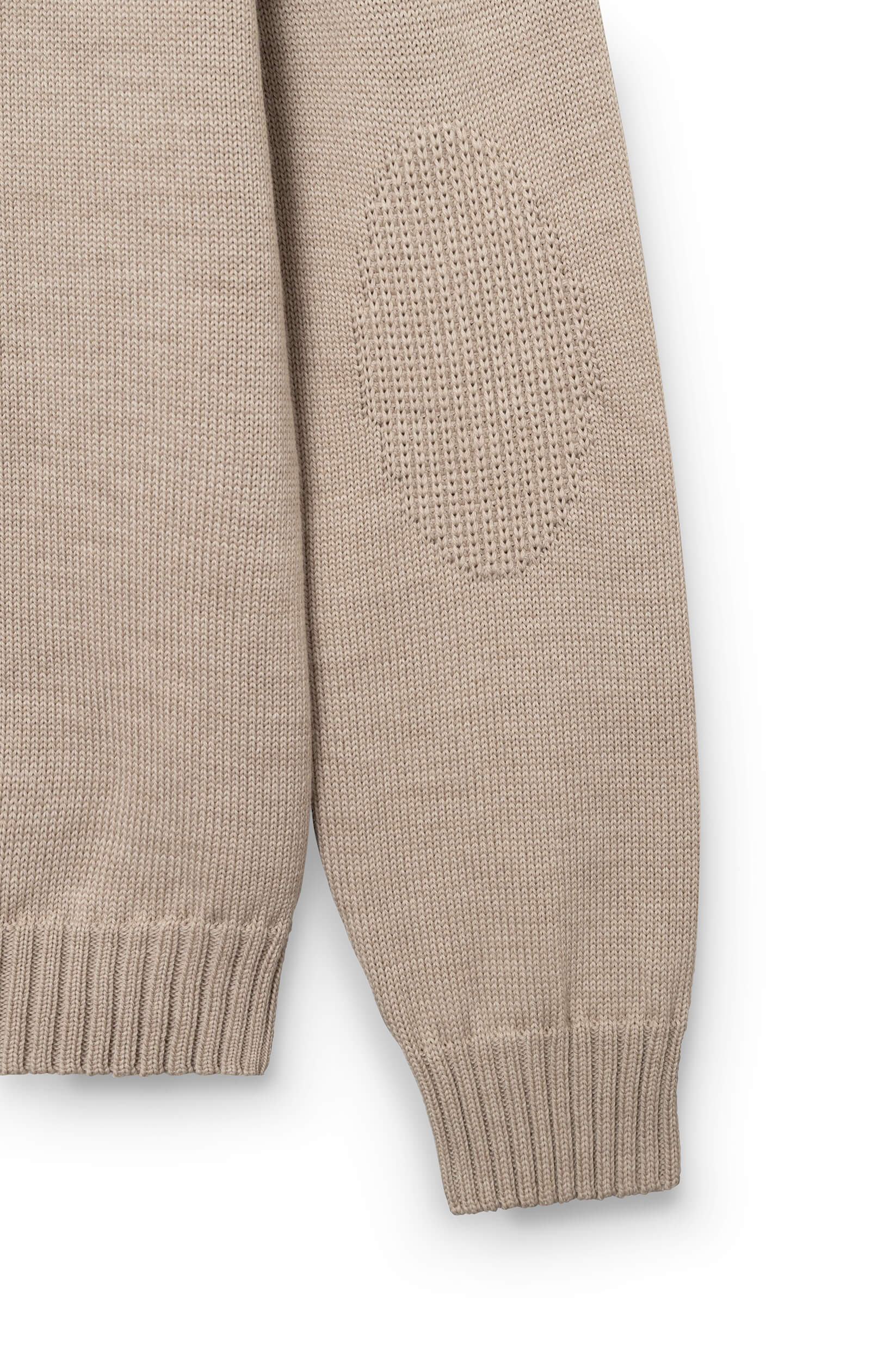 Detail of the sleeve of the beige pullover in merino wool