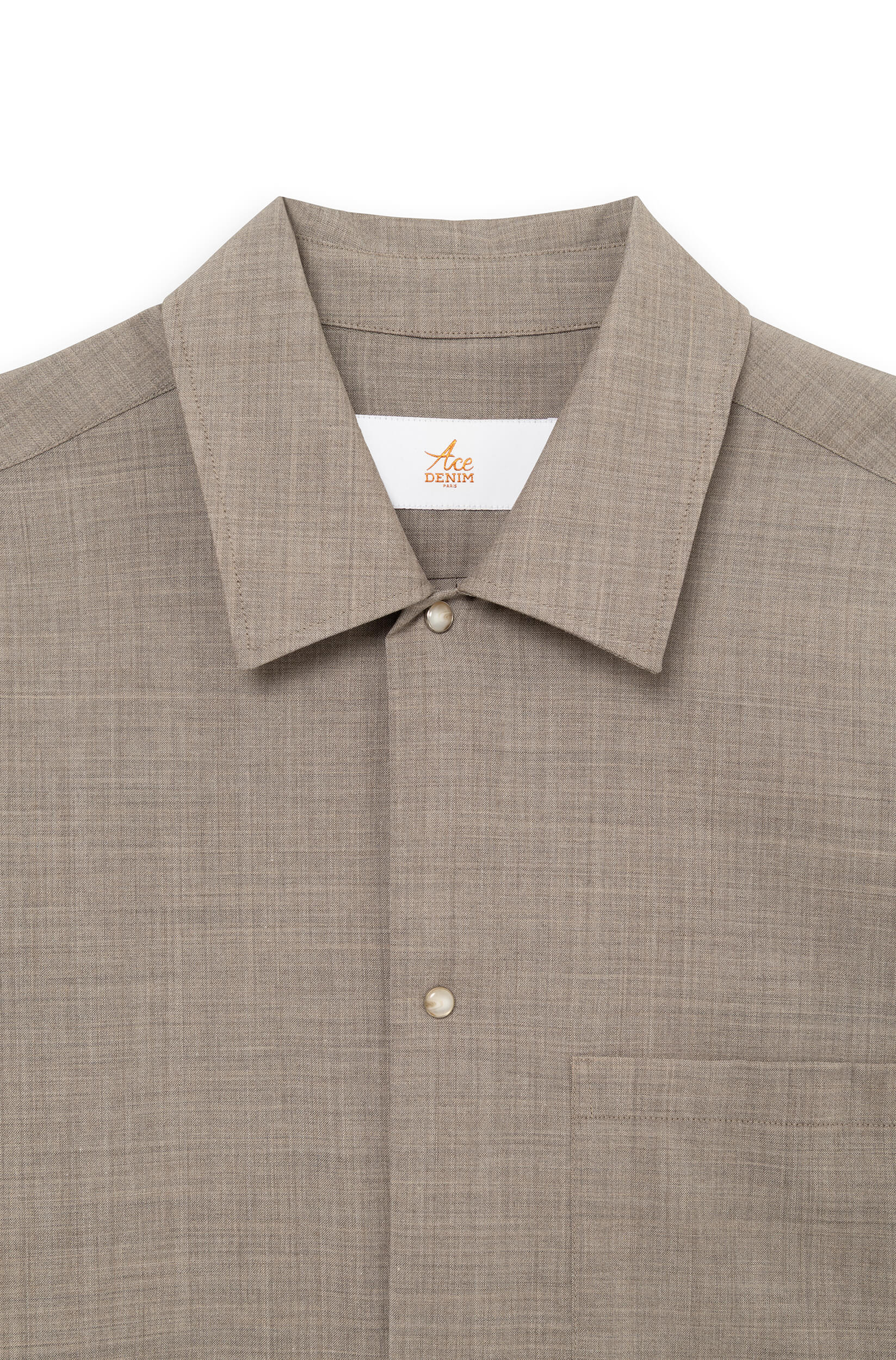 Detail of the classic shirt collar and signature snap buttons — AD 82 Ace Denim Paris