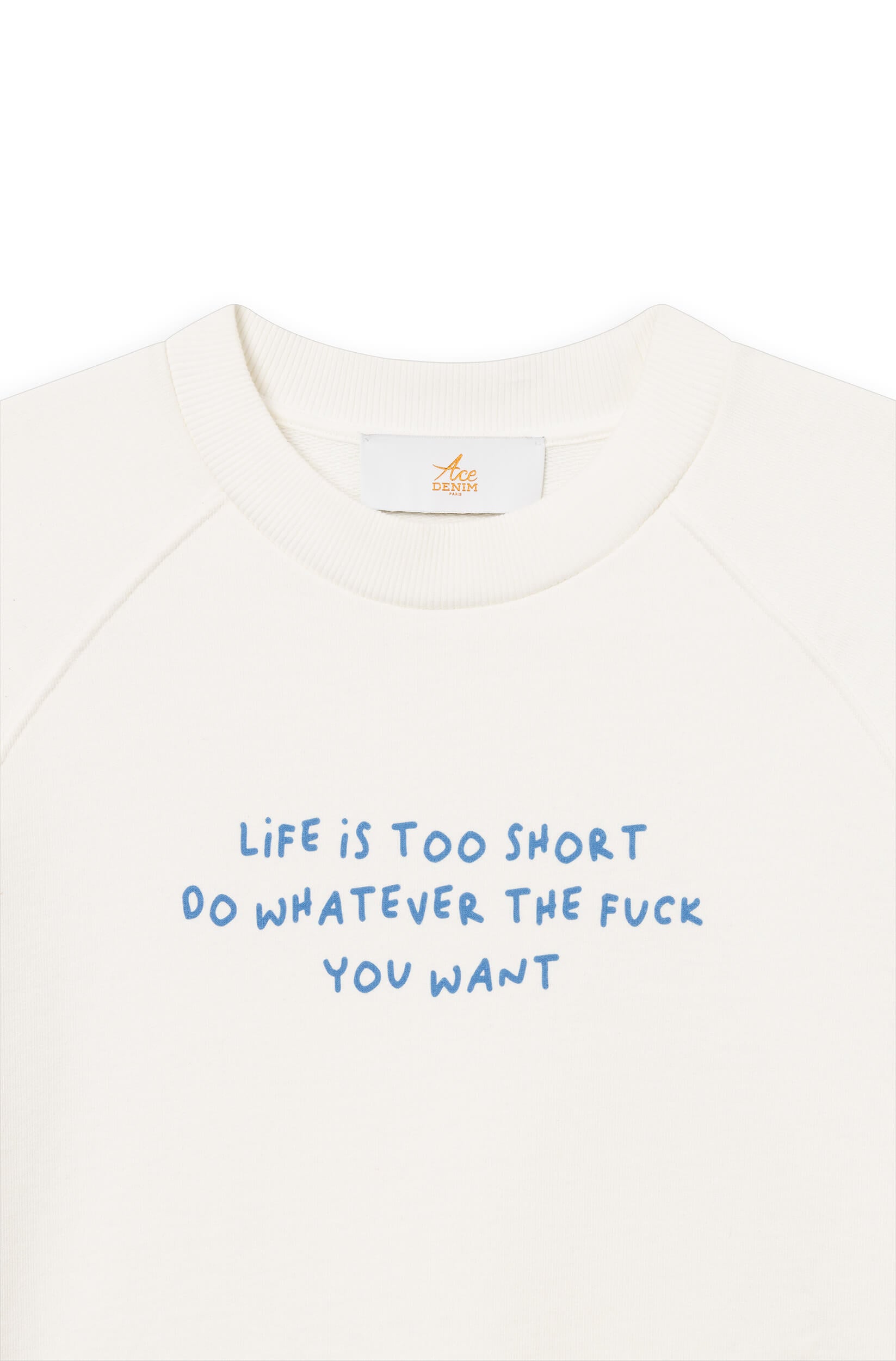 Close-up of the off-white cotton sweatshirt dyed by hand with the phrase "life is too short, do whatever the f*** you want"