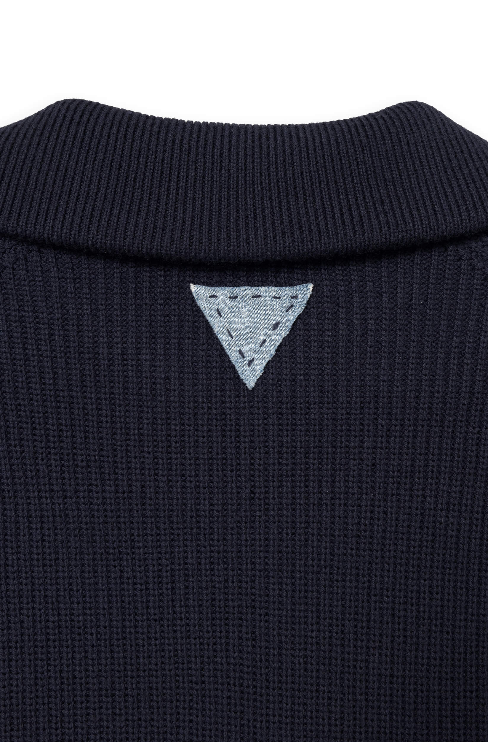Detail of the denim triangle at the neck