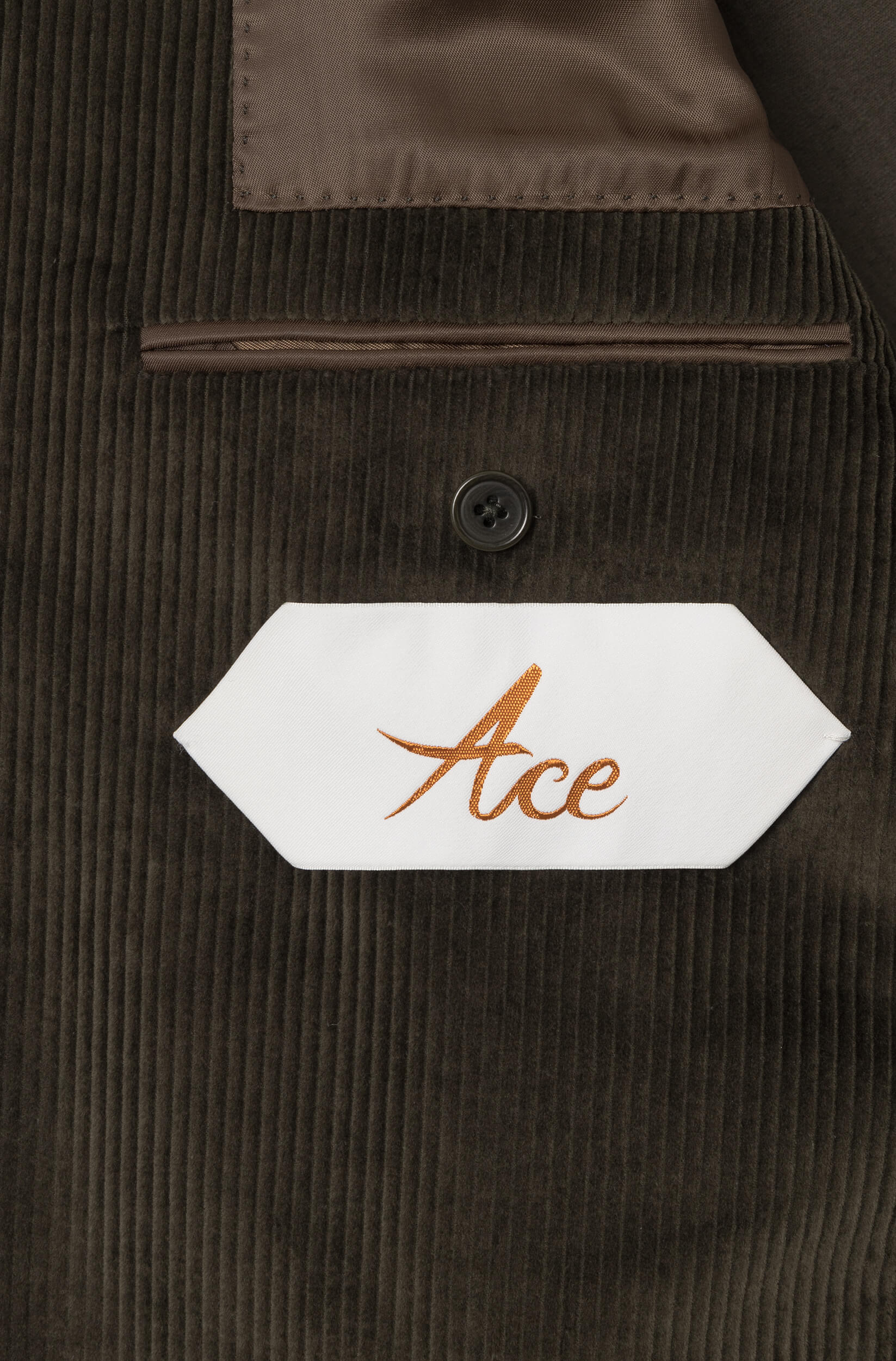 Detail of the Ace Denim Paris label inside the crossed khaki velvet jacket