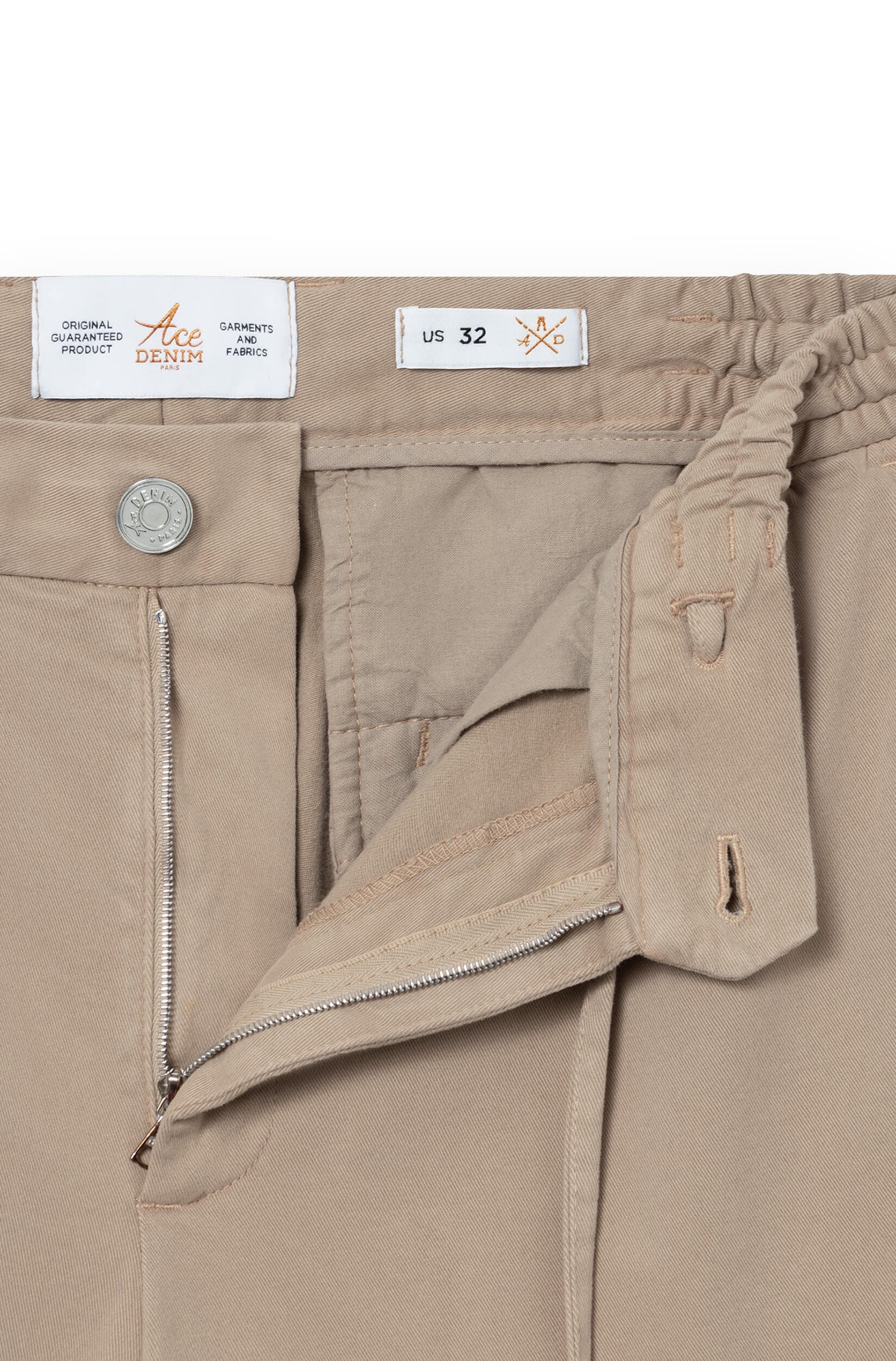 Detail of the fly and metal button of the beige cashmere chino
