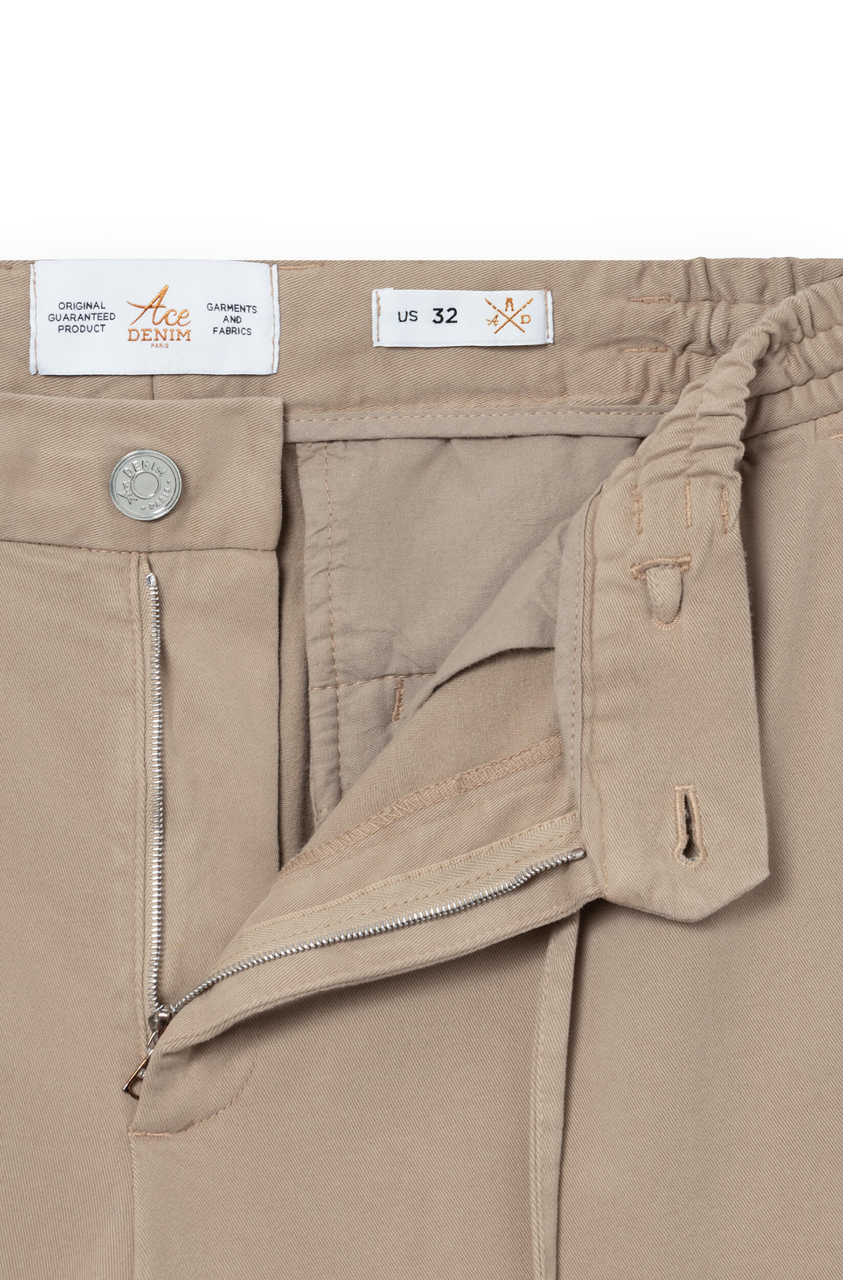 Detail of the fly and metal button of the beige cashmere chino