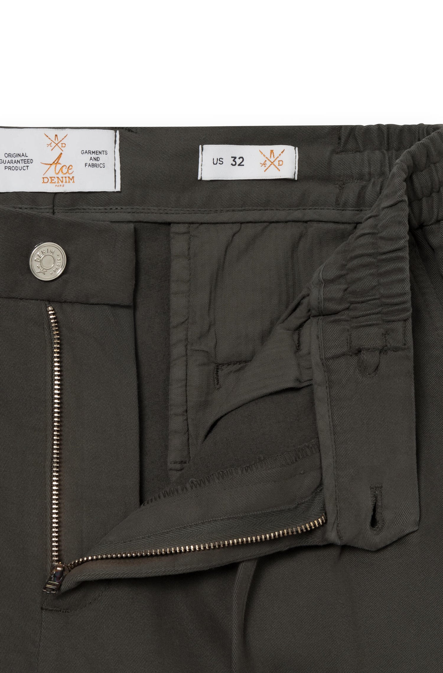 Close-up of the zipped fly of the khaki cashmere trousers