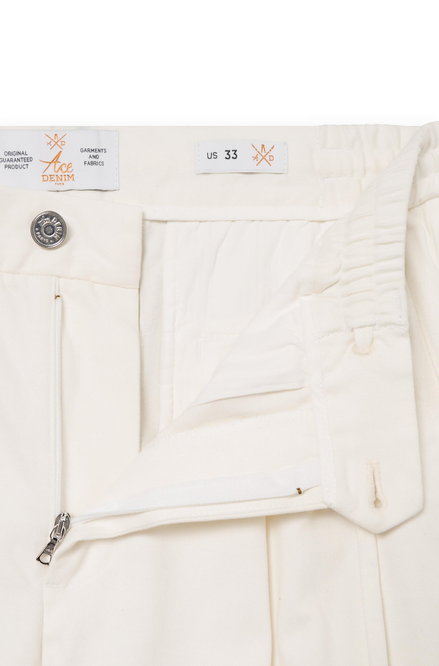 Close-up on the zipped fly of the cream white cashmere trousers
