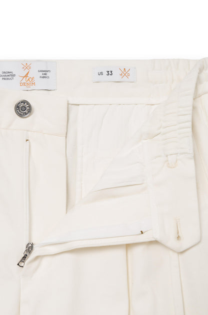 Close-up on the zipped fly of the cream white cashmere trousers