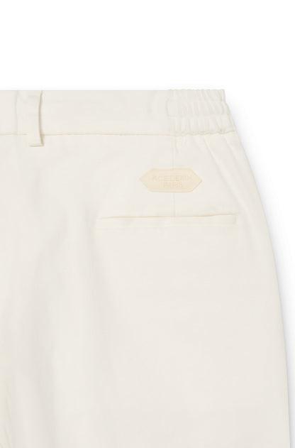back of the cream white chinos trousers in cashmere for men with the ace denim paris patch