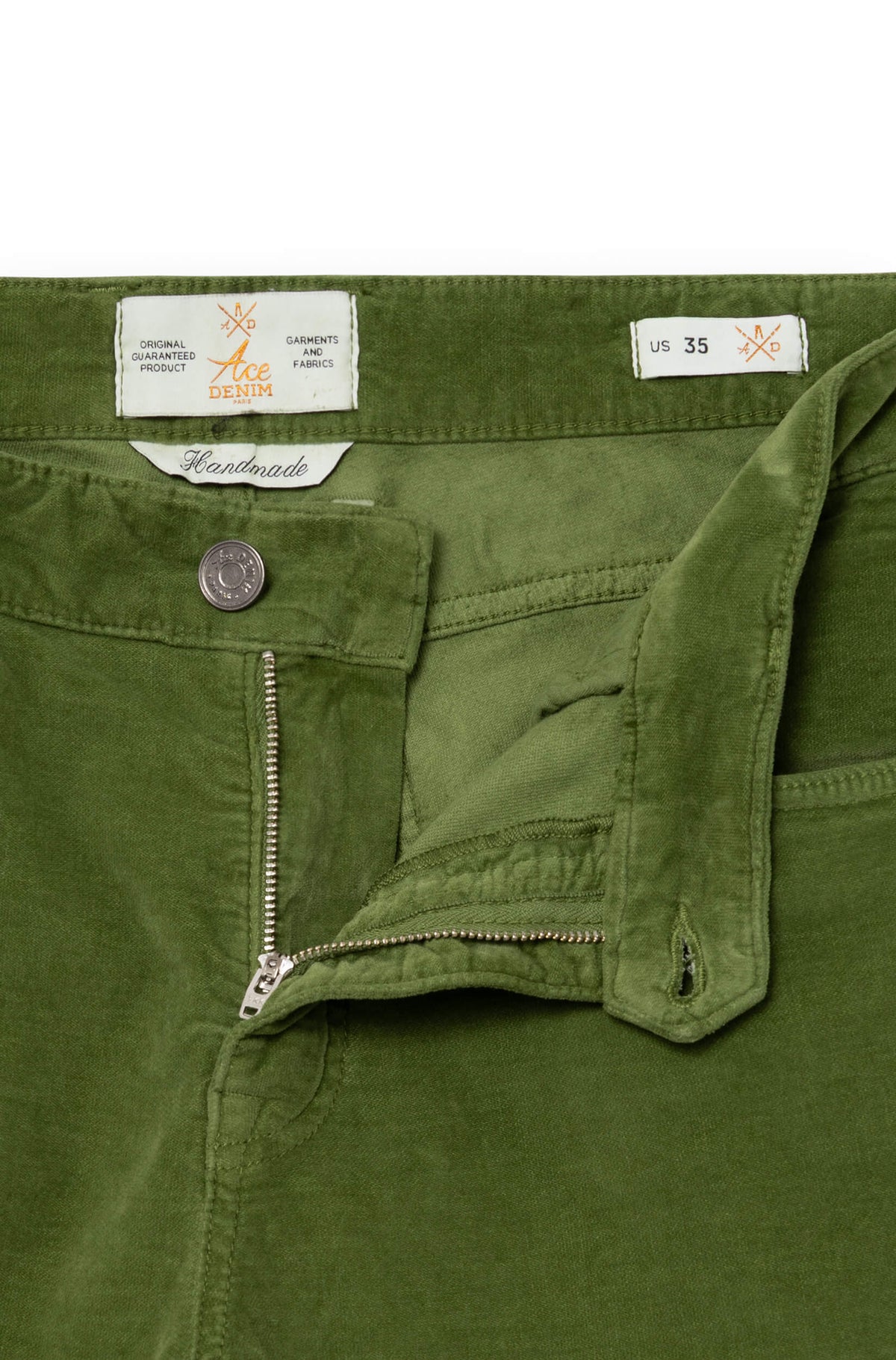 Close-up on the fly of the green trousers