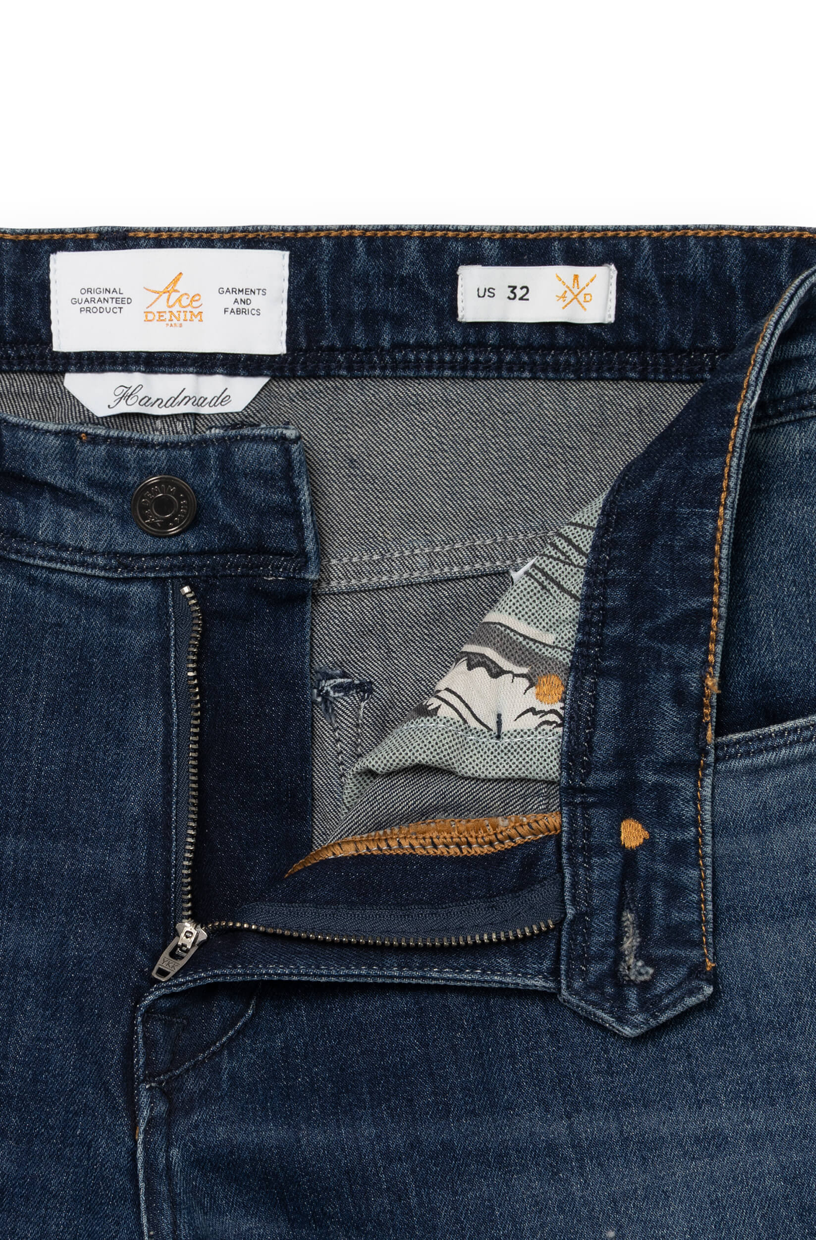 Detail of the front of the dark blue jeans AD03 with metal button and fly
