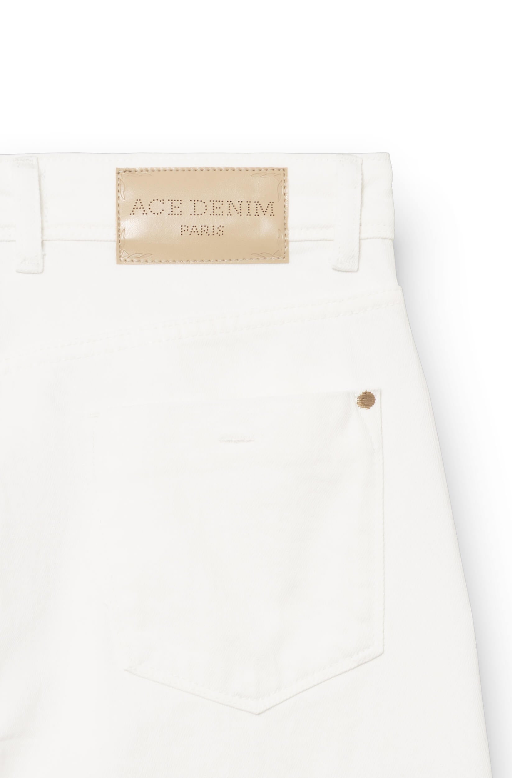 Detail of the back of the jeans with a beige leather patch engraved Ace Denim Paris
