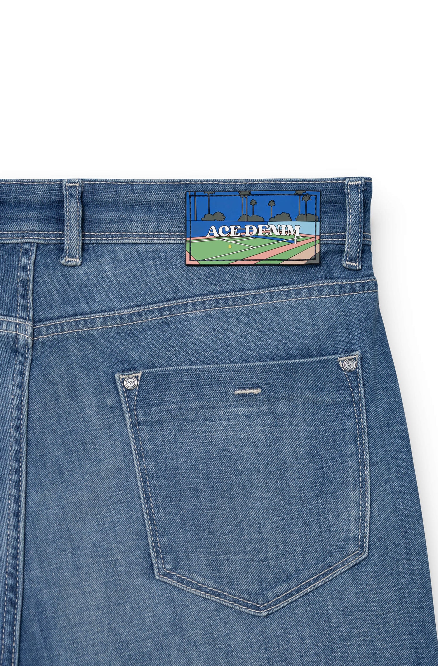 Detail of silicone signature patch on back waistband — AD 33 Ace Denim Paris