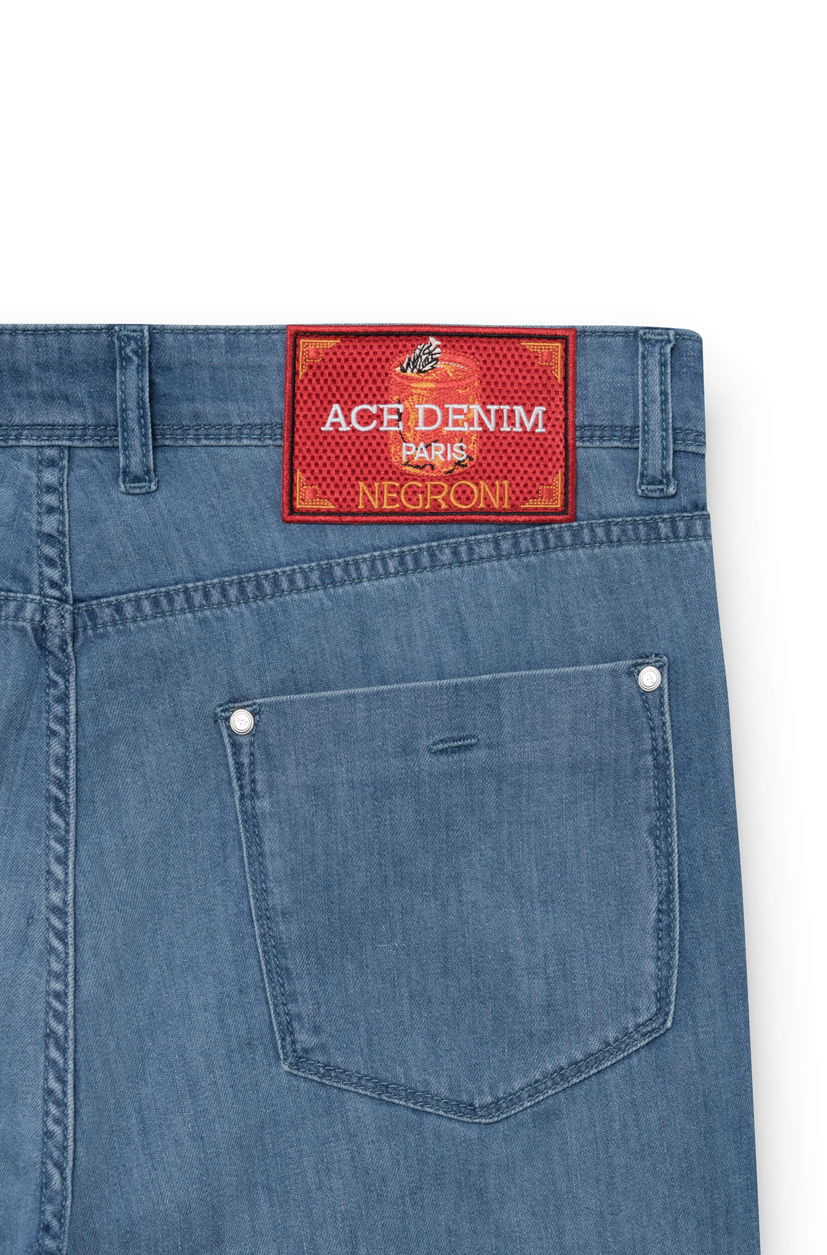 Patch with Negroni cocktail design on the back of the jeans
