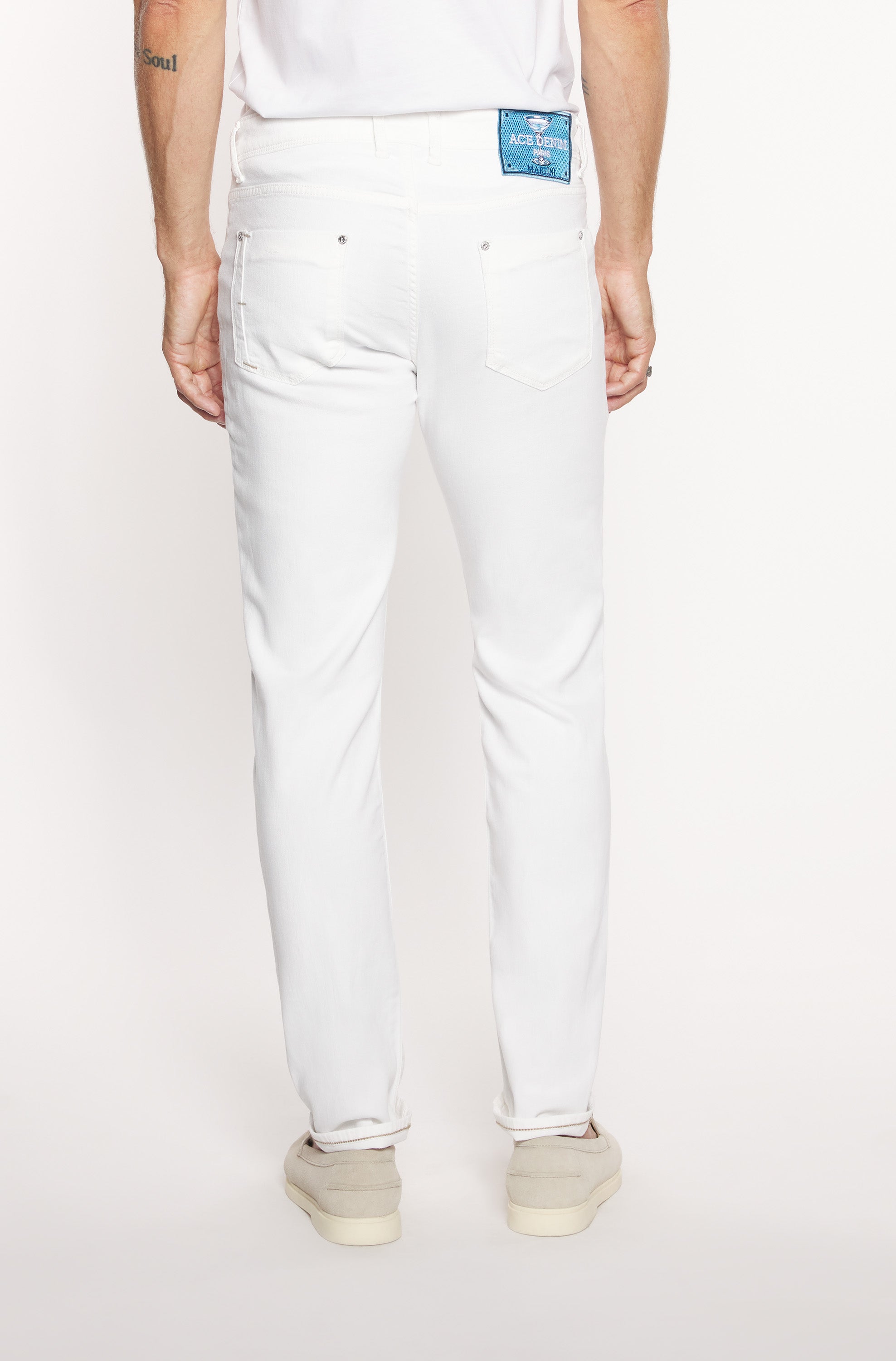 Back of the model wearing the slim jeans in white cotton and flax for men