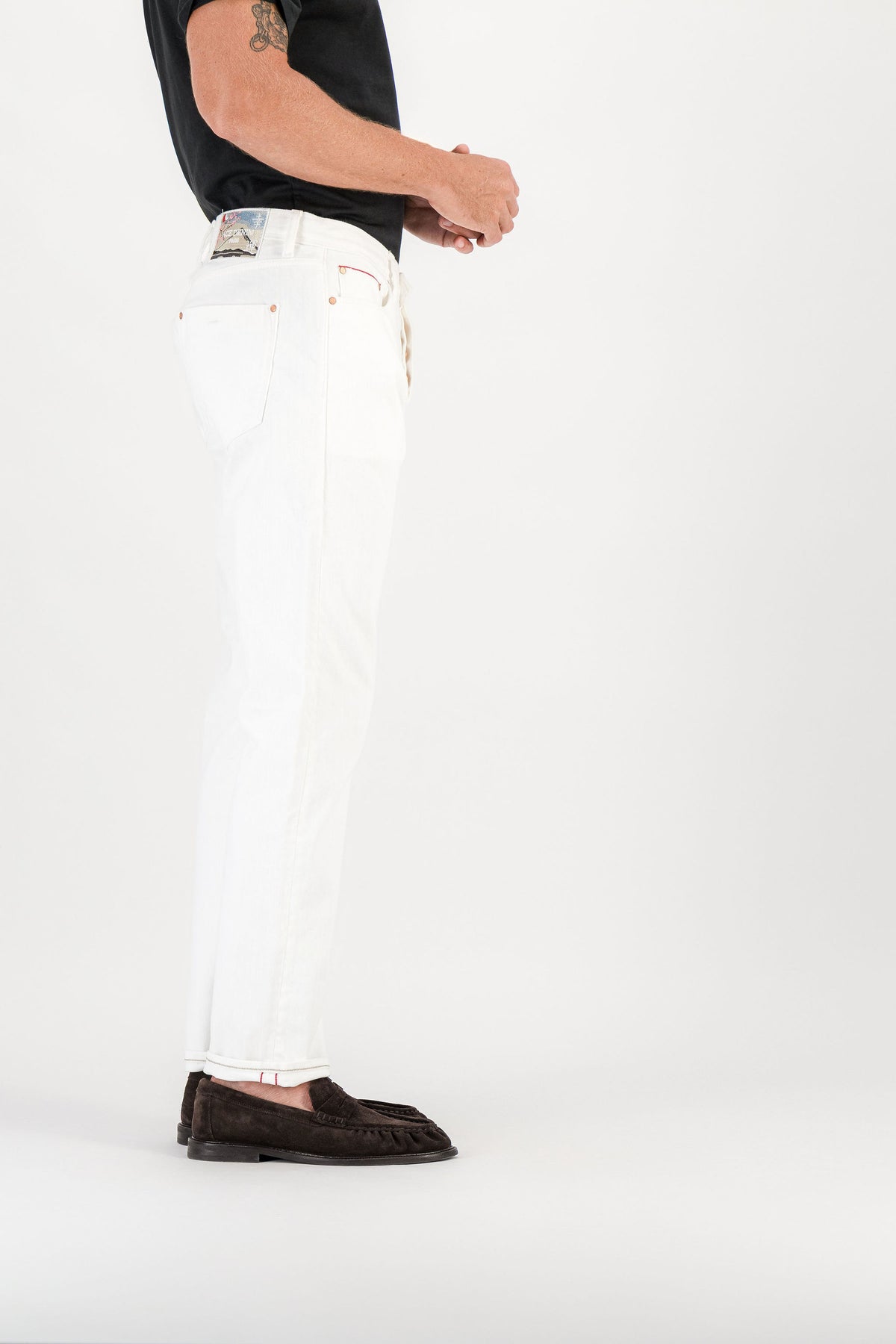 White selvedge straight jeans side view, Mont Fuji embroidered patch visible on waistband — AD 53 Selvedge Ace Denim Paris