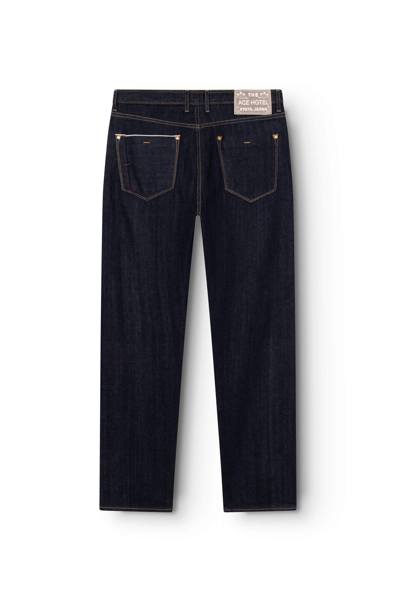 Back view of raw selvedge straight jeans with embroidered signature patch on waistband — AD 53 Selvedge Ace Denim Paris