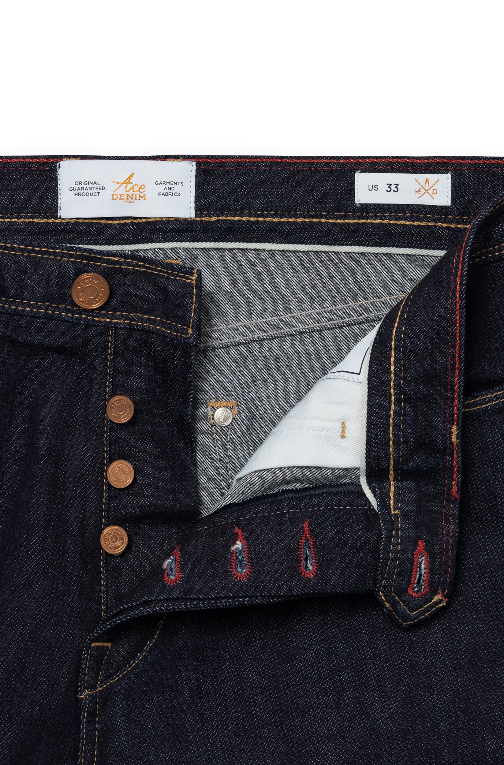 Detail of engraved copper button fly, red selvedge stripe and copper stitching — AD 53 Selvedge Ace Denim Paris