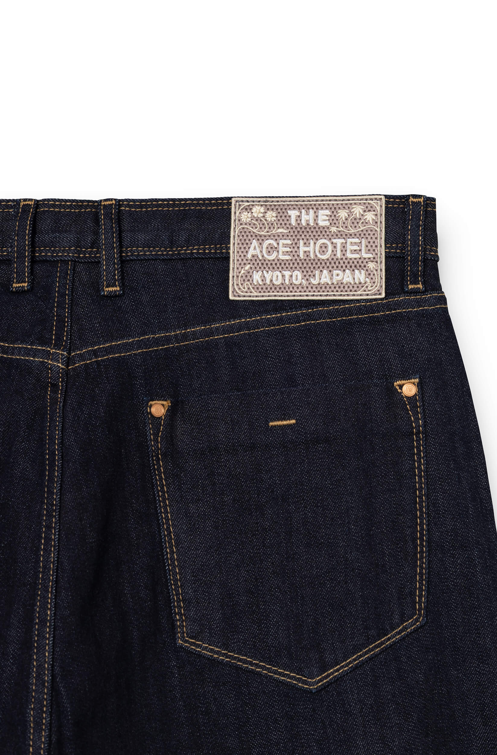 Detail of embroidered signature patch on back waistband of raw AD 53 Selvedge — Ace Denim Paris