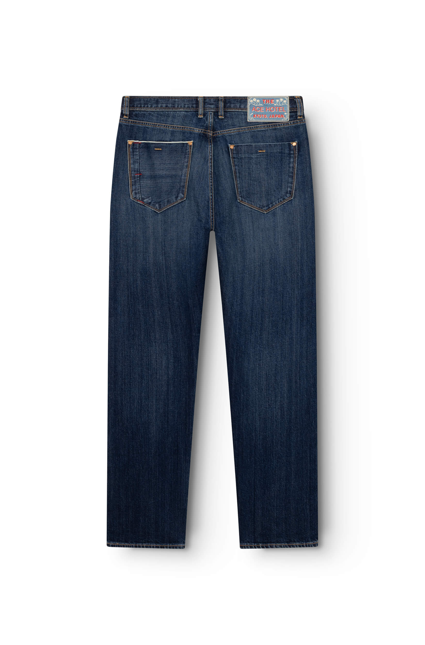 Back view of dark stone selvedge straight fit jeans with embroidered signature patch on waistband — AD 53 Selvedge Ace Denim Paris