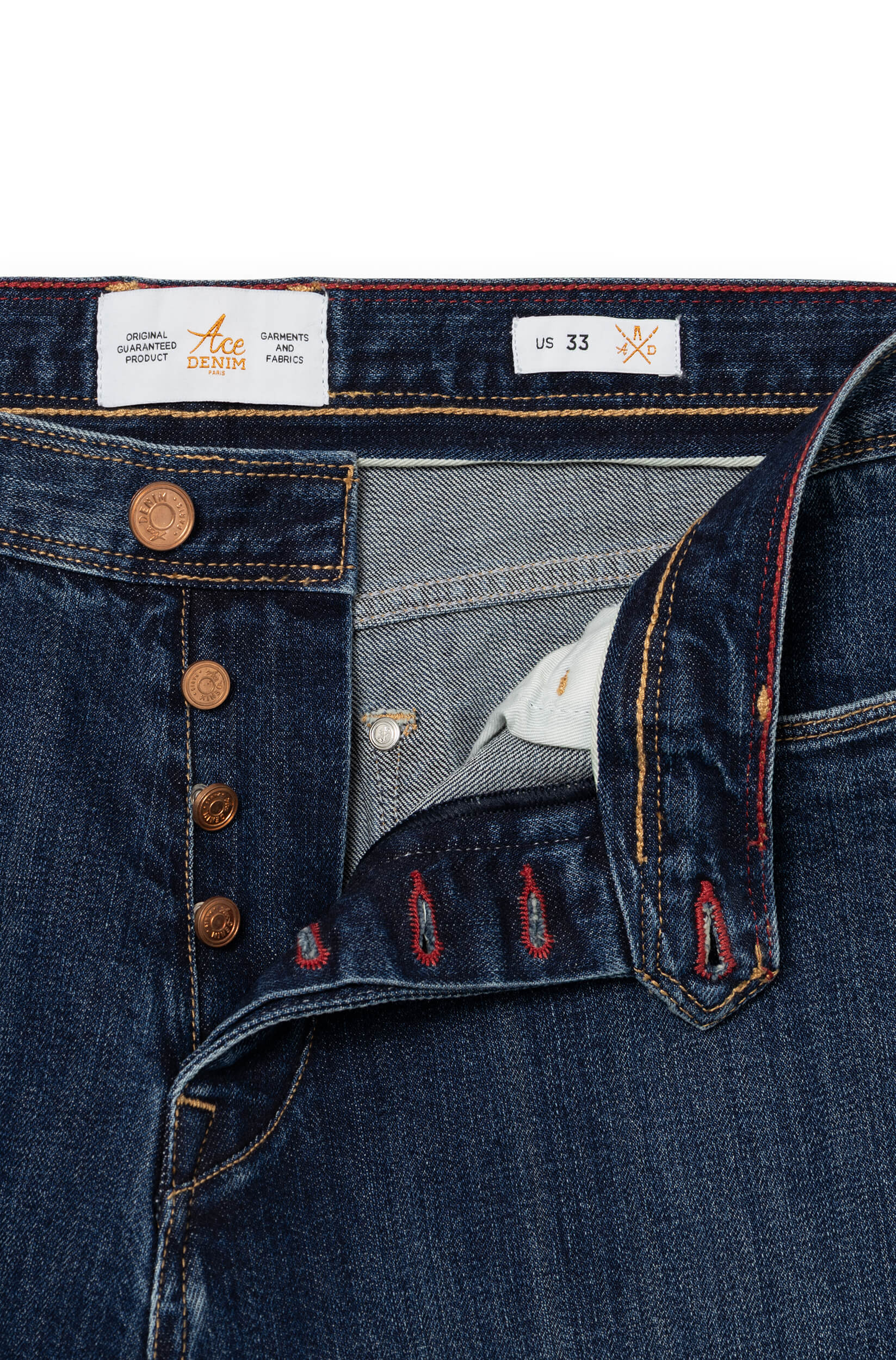 Detail of engraved copper button fly with red and gold interior stitching — AD 53 Selvedge Ace Denim Paris