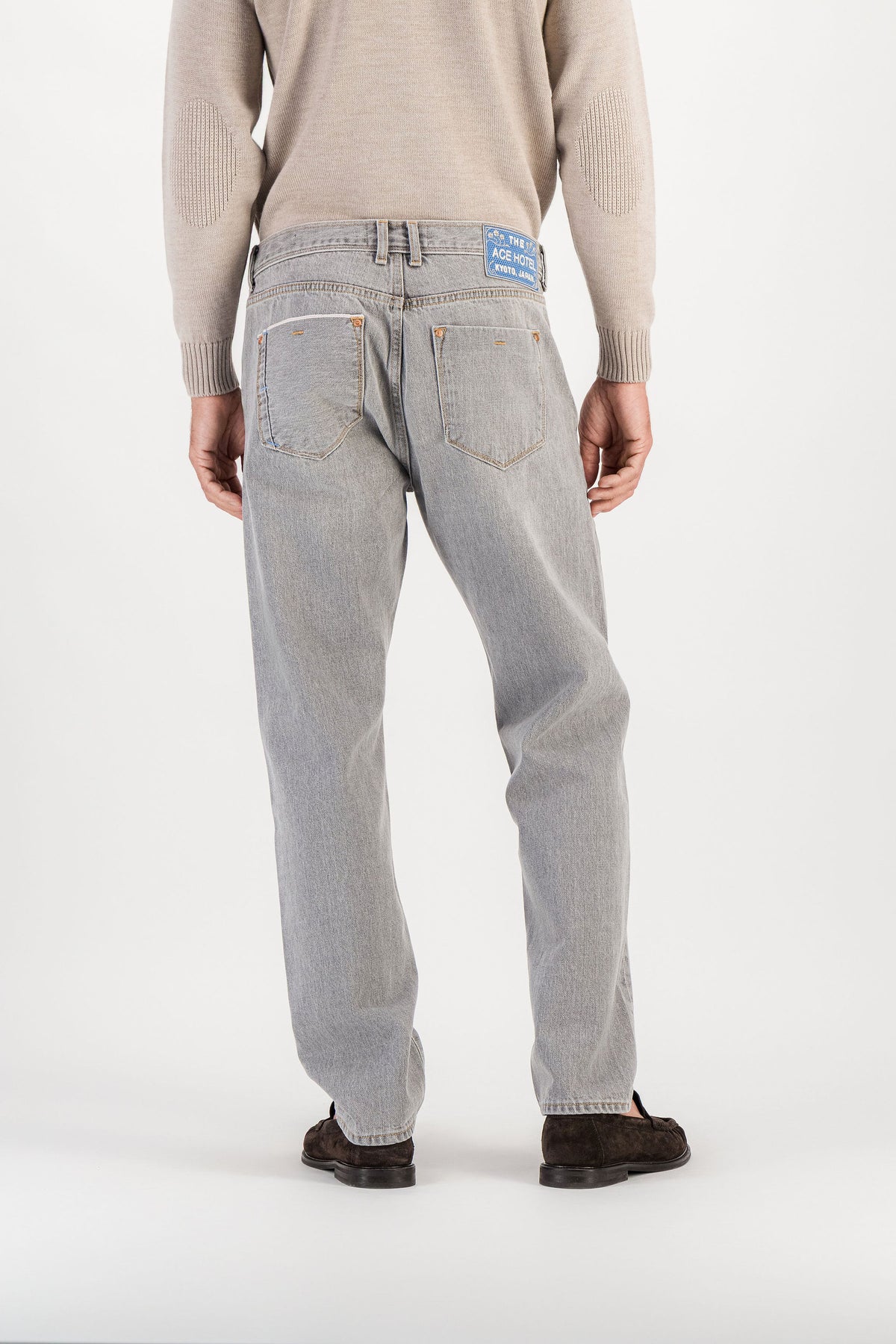 Back view light grey selvedge straight jeans worn, back pockets and Ace Hotel Kyoto embroidered patch — AD 53 Selvedge Ace Denim Paris