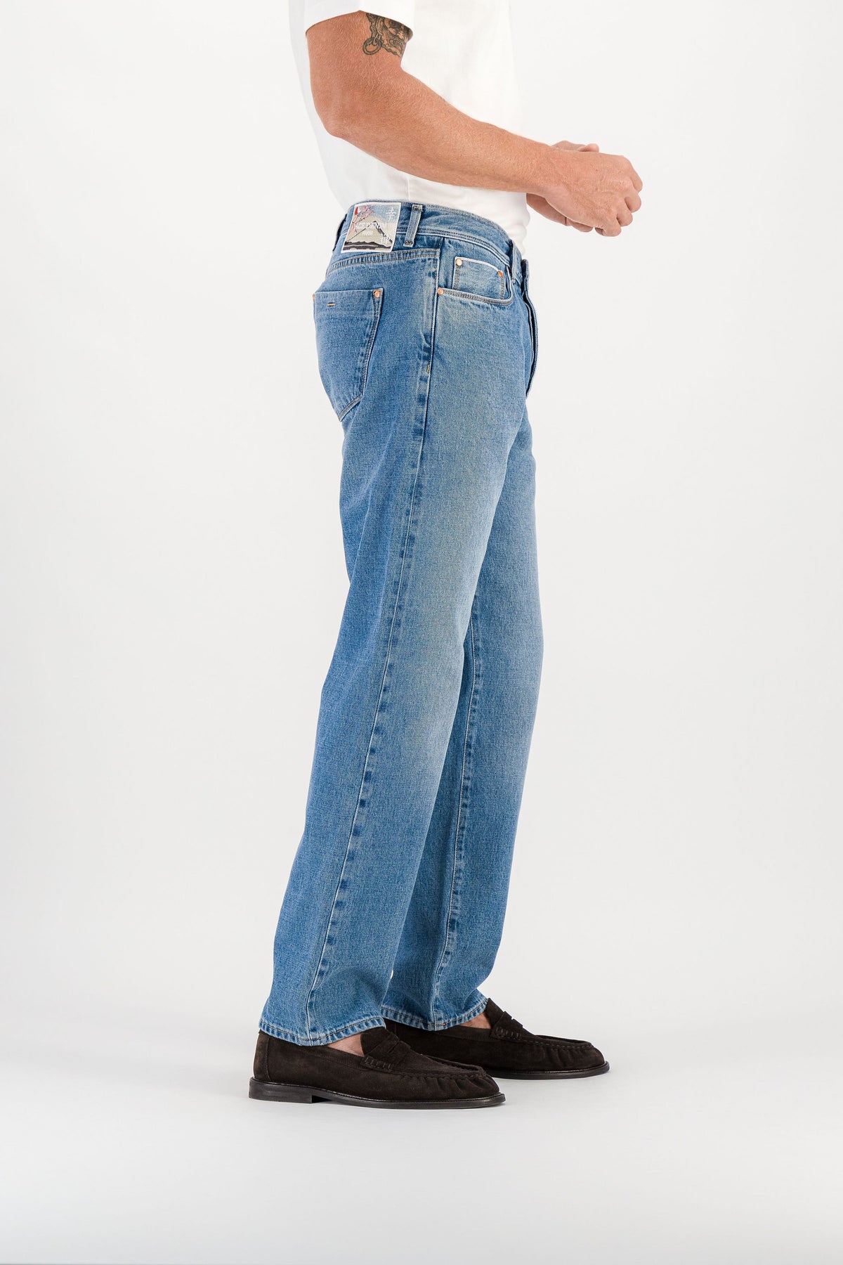 Blue stone selvedge straight jeans side view, Mont Fuji embroidered patch visible on waistband — AD 53 Selvedge Ace Denim Paris