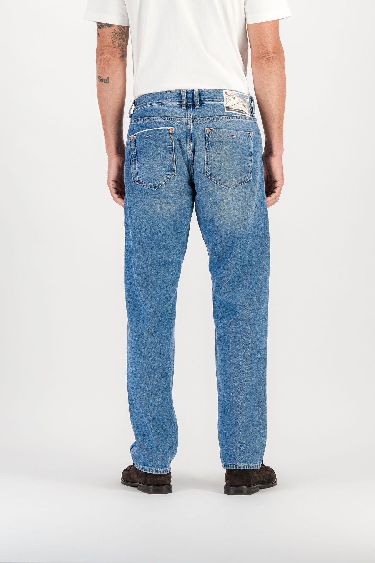 Back view blue stone selvedge straight jeans worn, back pockets and Mont Fuji embroidered patch — AD 53 Selvedge Ace Denim Paris