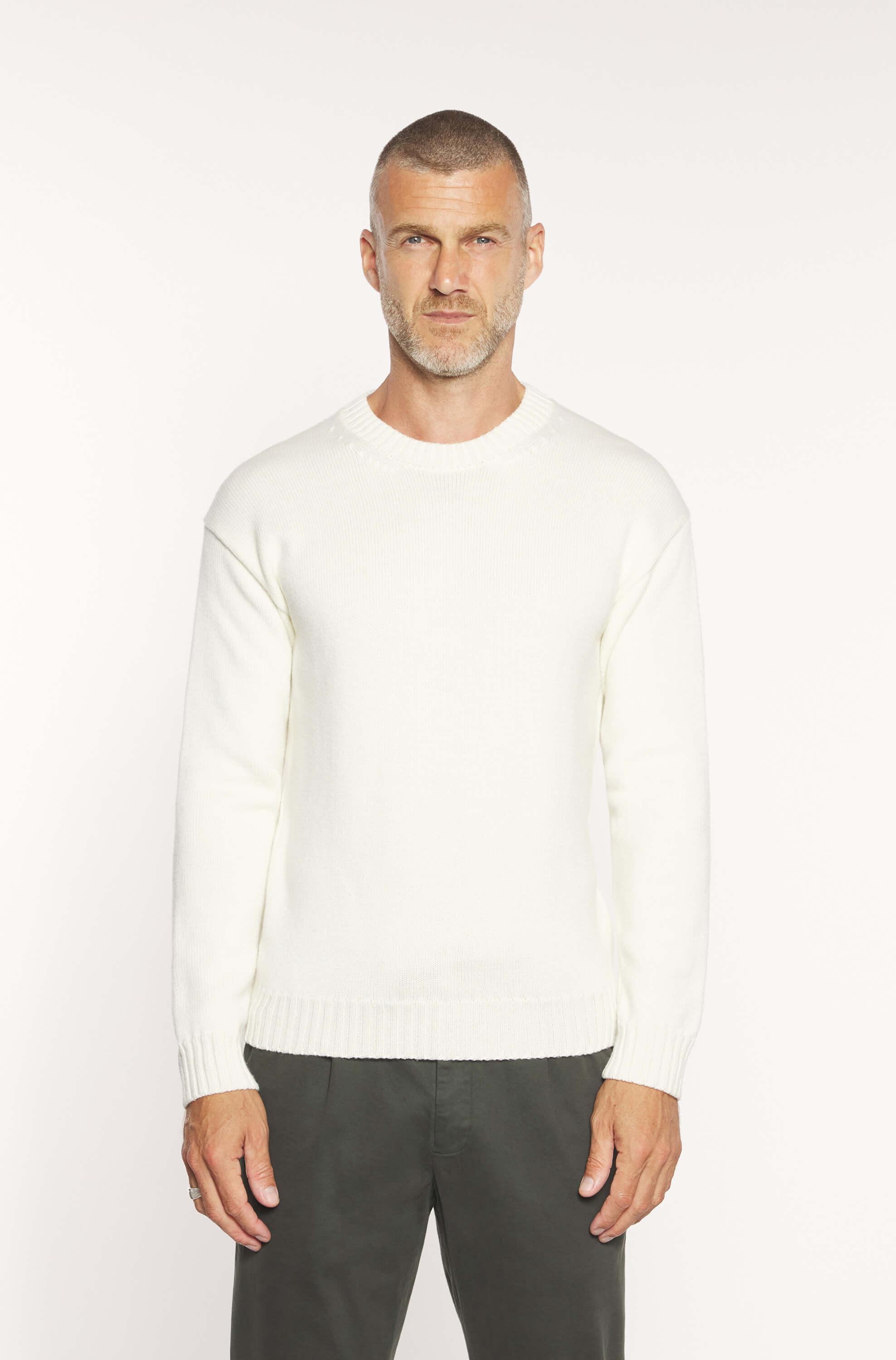 Mannequin wearing the off-white round-neck sweater