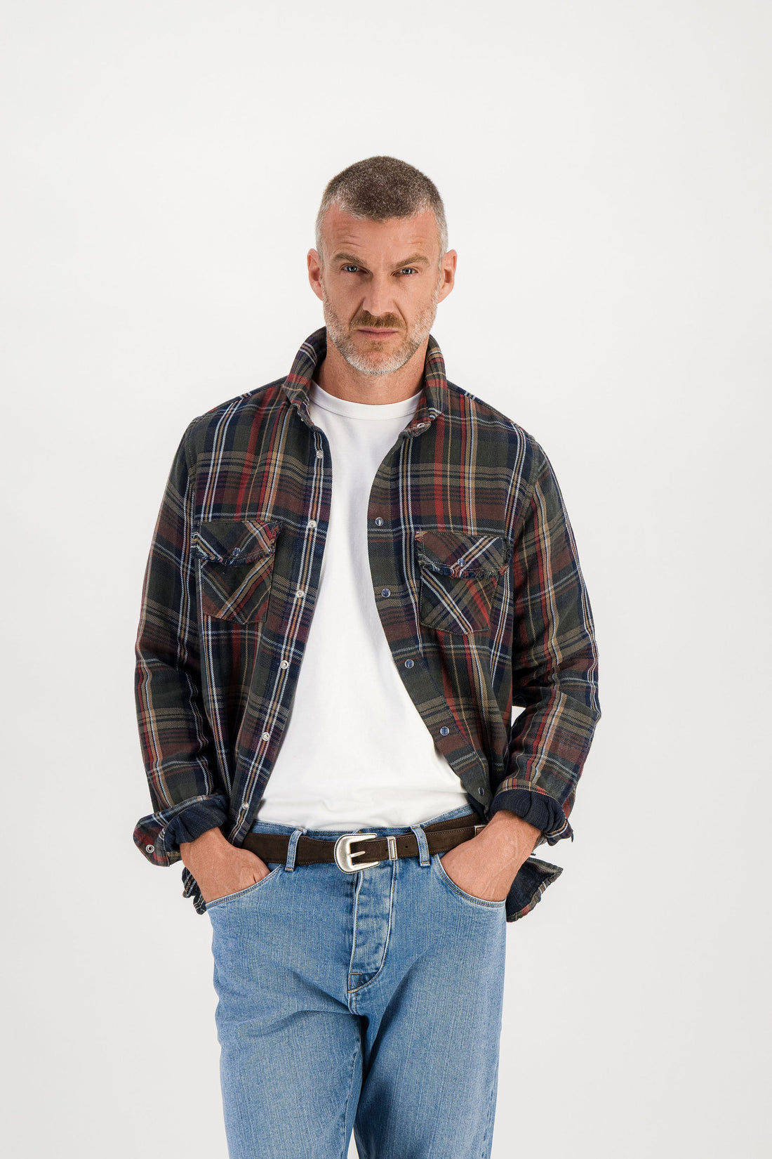 Front worn bust shot, tartan shirt open over white t-shirt, hands in front pockets, model 186 cm size M — Ace Denim Paris