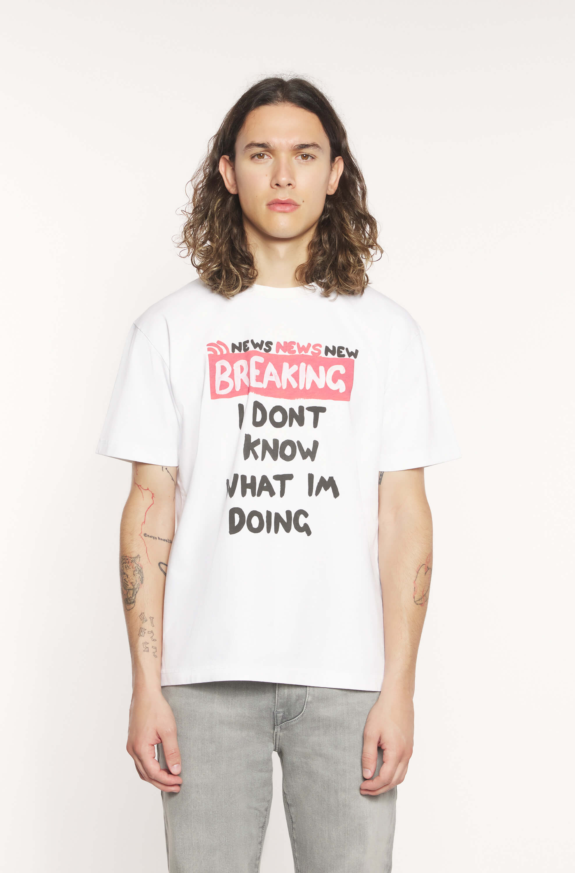 Mannequin wearing the white t-shirt with black "breaking i don&