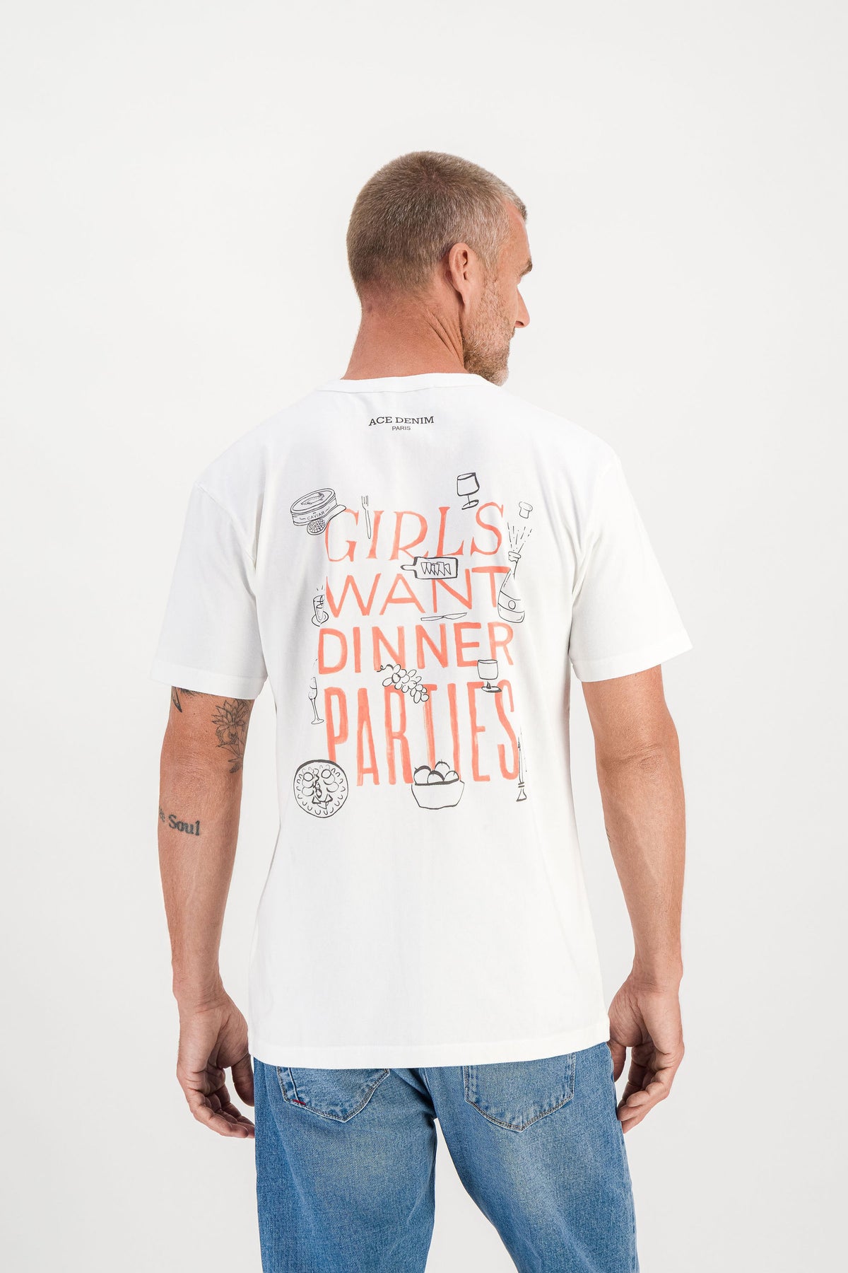 T-shirt Dinner Parties Blanc worn back view, Girls Want Dinner Parties illustration on back, mannequin 1m86 size M — Ace Denim Paris