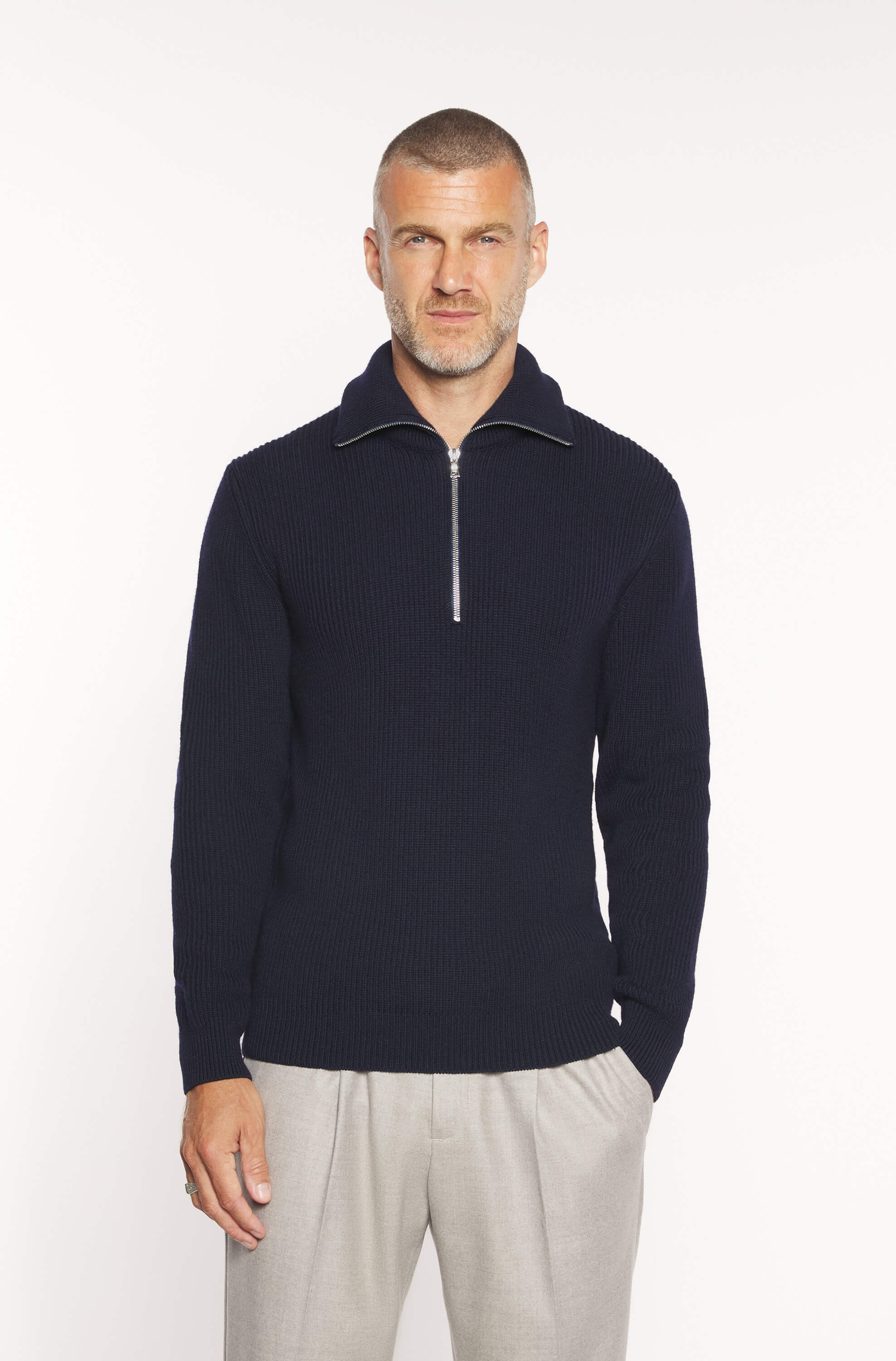 Mannequin wearing the navy zip-neck sweater