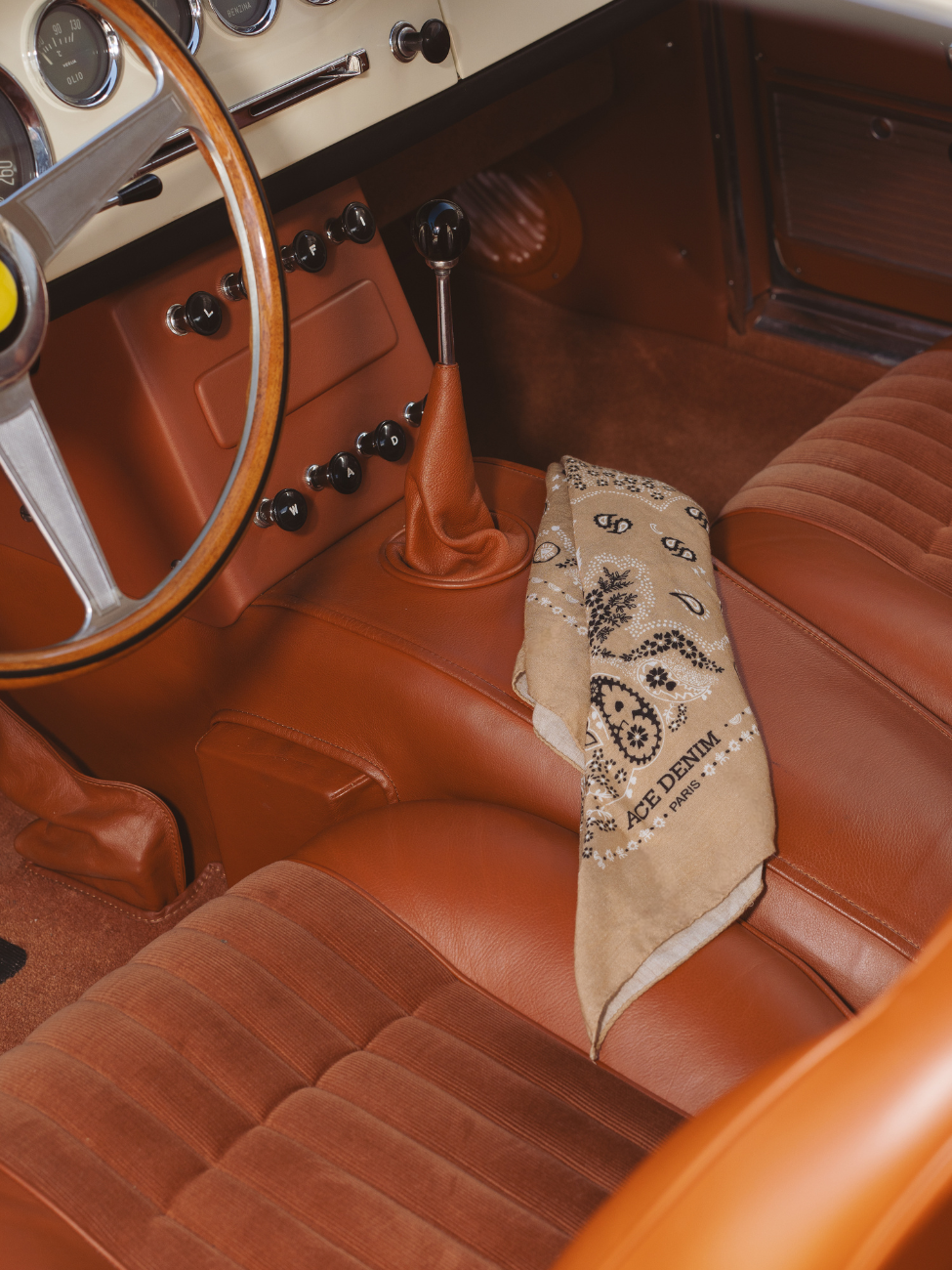 Unisex beige silk scarf in a Ferrari 250 SWB with brown leather interior